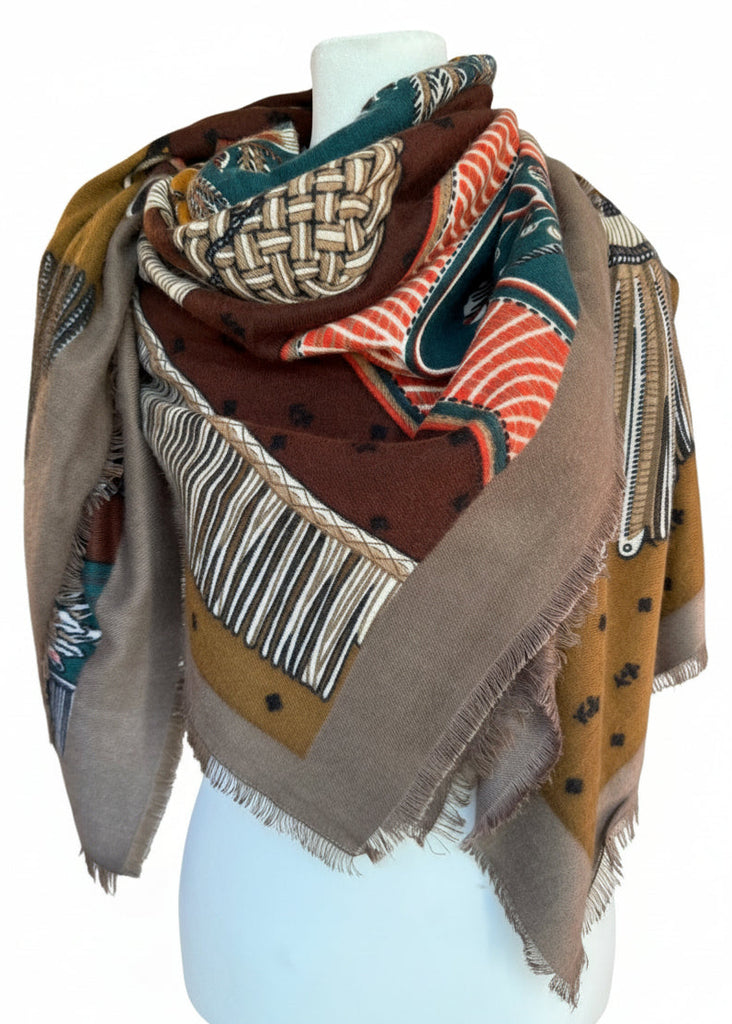 Collection of patterned scarves on a mannequin in a store setting