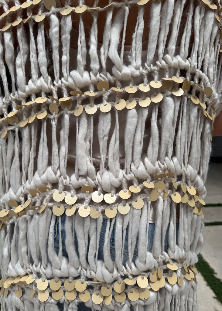 Decorative item with gold sequins and white fabric