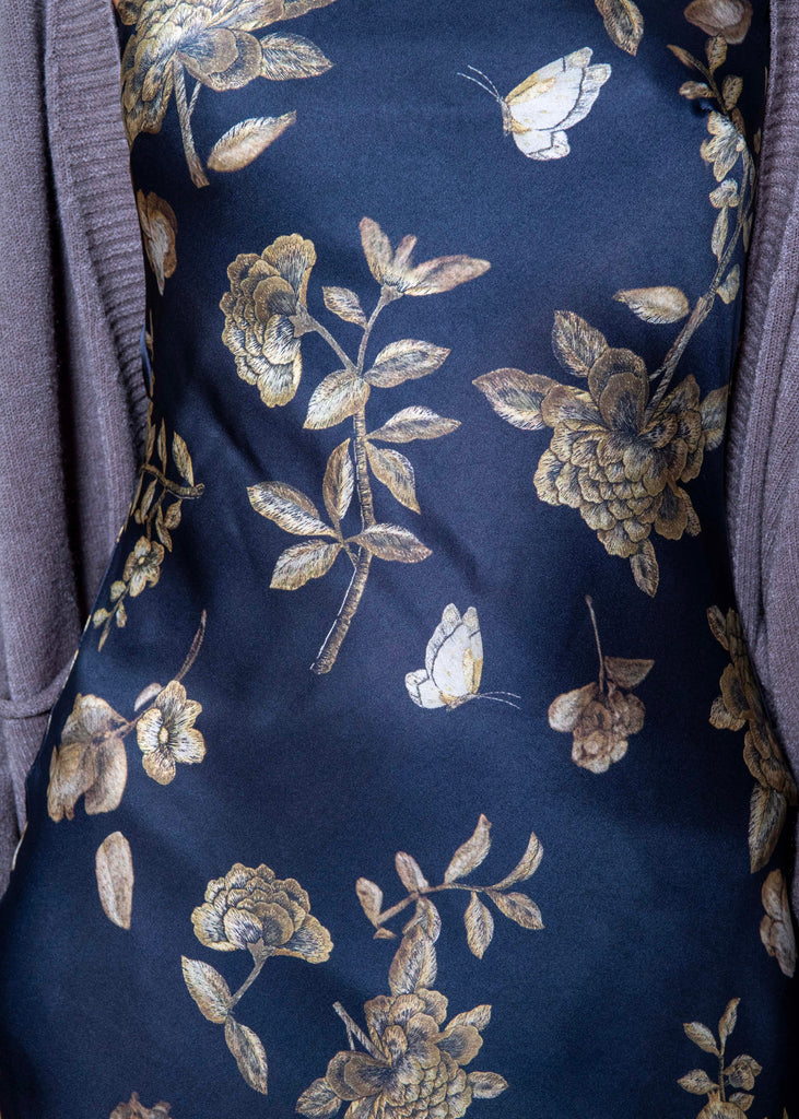Navy fabric with gold floral and butterfly pattern