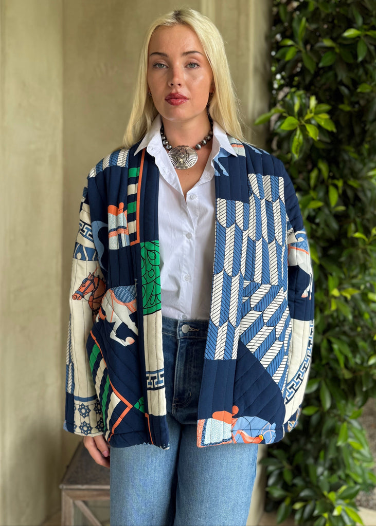 Woman wearing a colorful patterned jacket outdoors