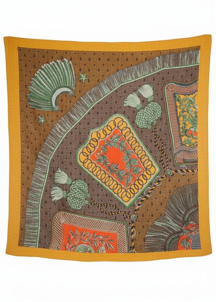 Decorative blanket with intricate patterns on a stand in an indoor setting