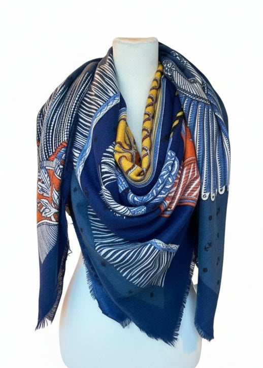 Blue patterned scarf on a mannequin in a storage room.