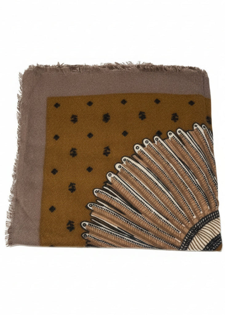 Square scarf with brown background, black dots, and white pattern on a white surface