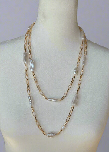 Necklace on a mannequin with a blurred background