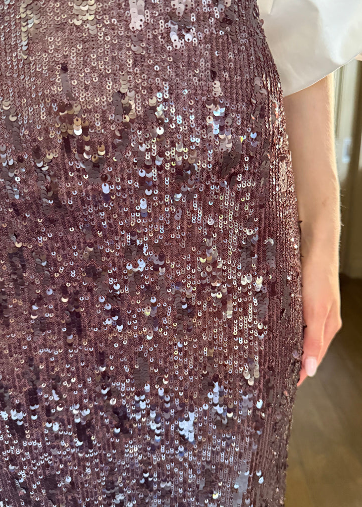 Close-up of a sequined dress with a blurred background