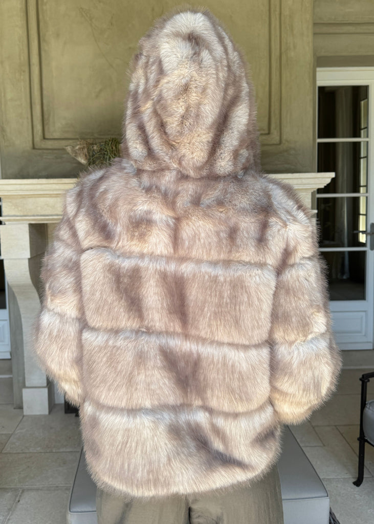 Mannequin wearing a fur coat in an indoor setting