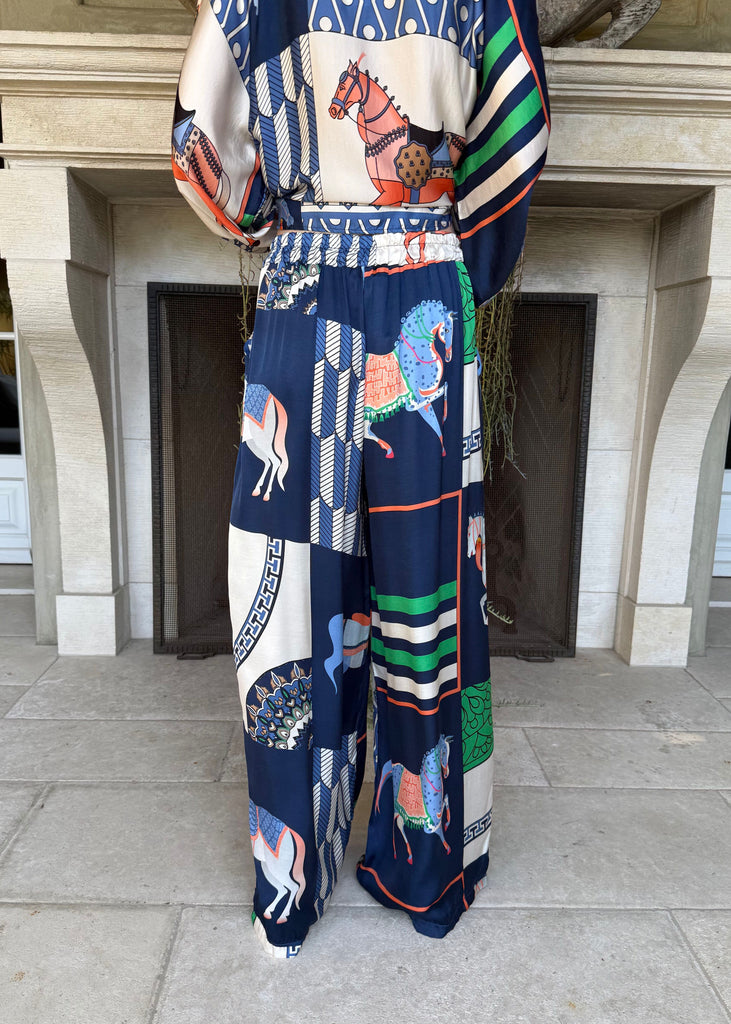 Colorful outfit with horse patterns on a neutral background