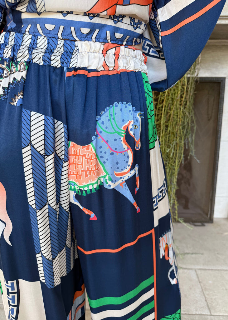 Colorful fabric with a horse design in an outdoor setting