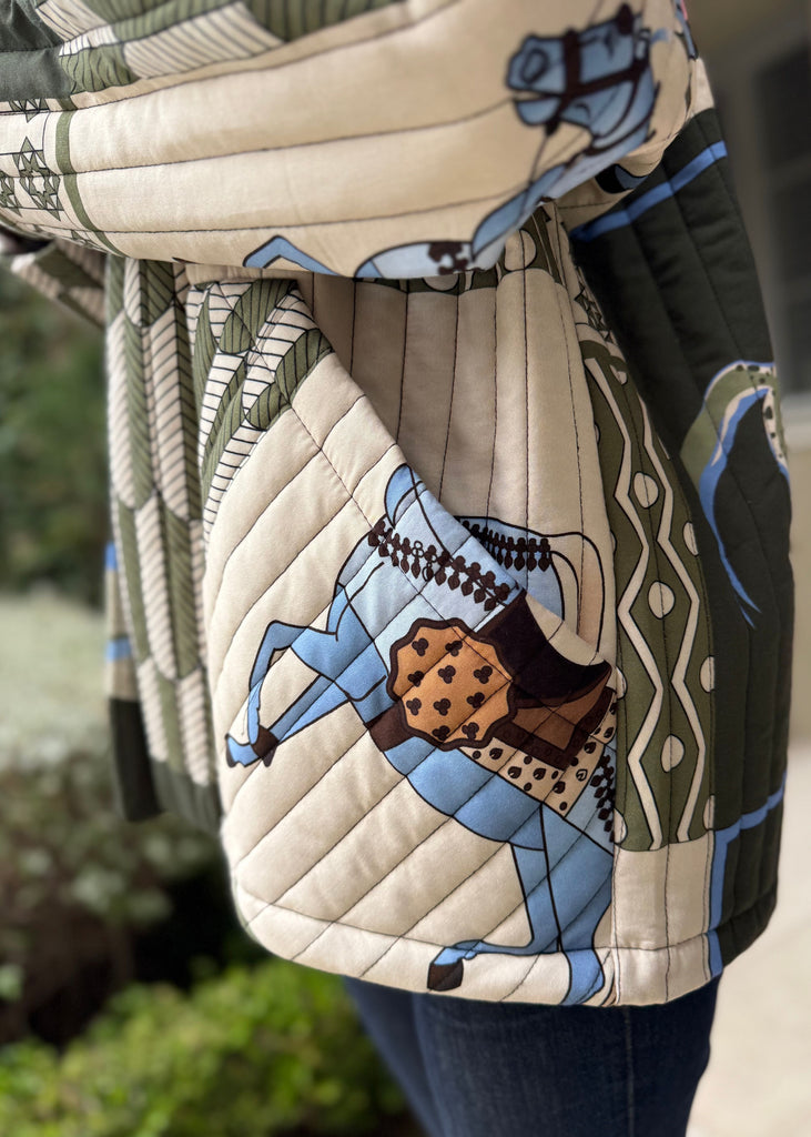 Quilted bag with horse design in a natural setting