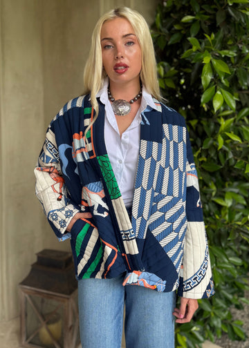 Person wearing a colorful patterned jacket outdoors