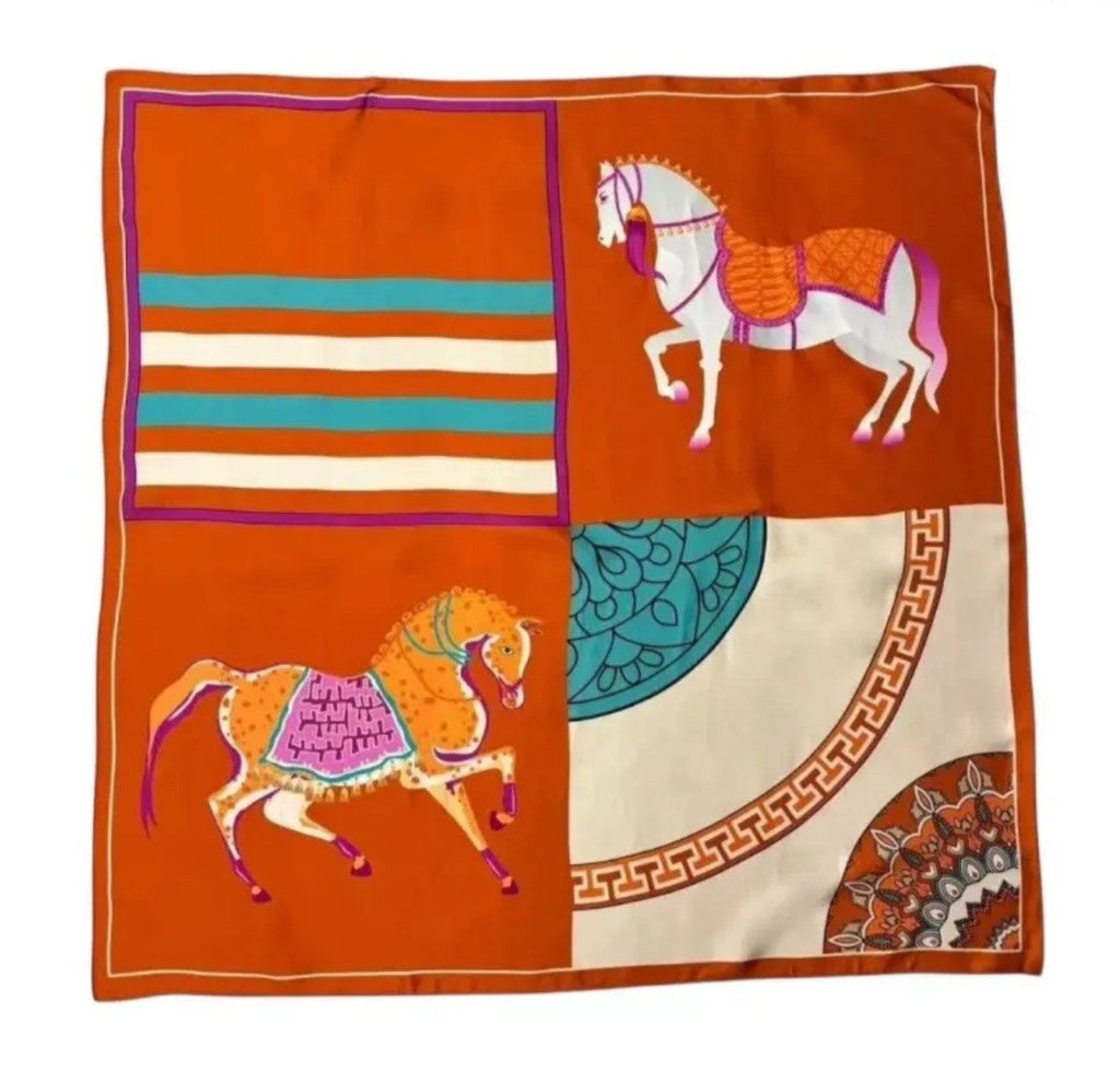 Decorative fabric square with horse designs on a black background